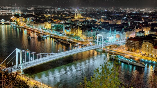 white bridge over river during night time in Citadella Hungary