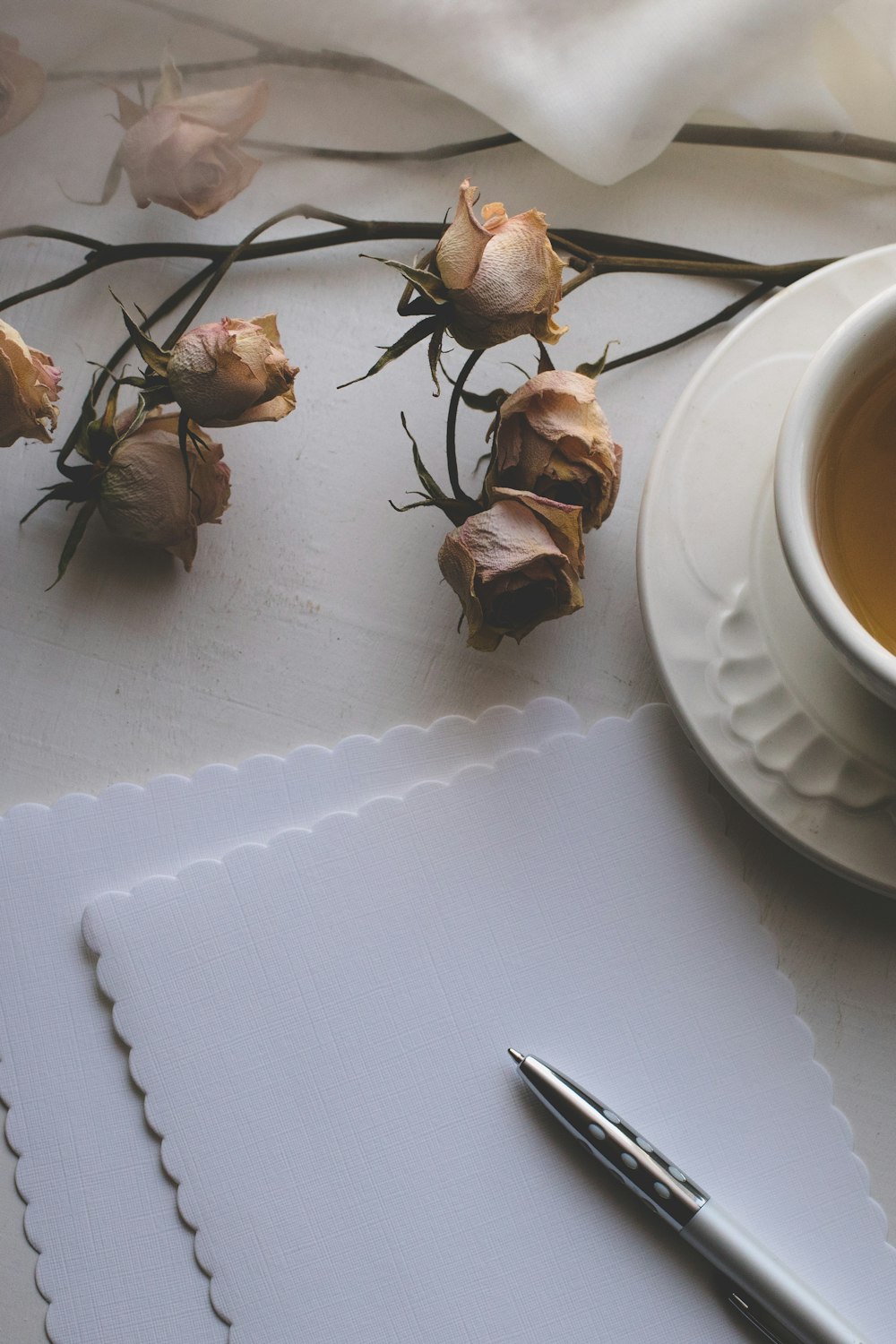 white ceramic teacup on white ceramic saucer