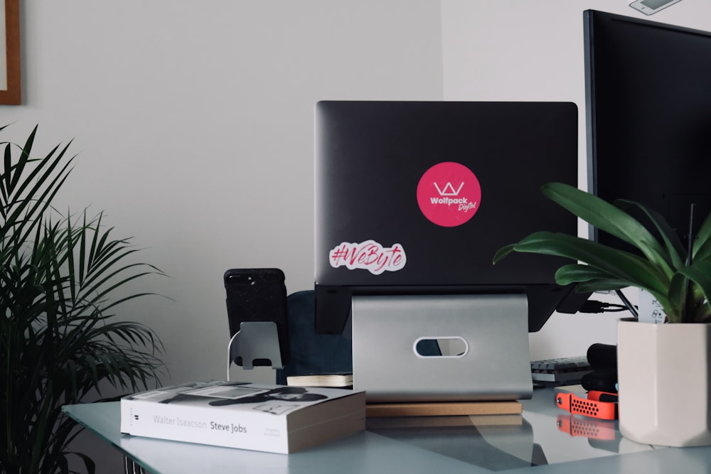 silver imac on brown wooden table