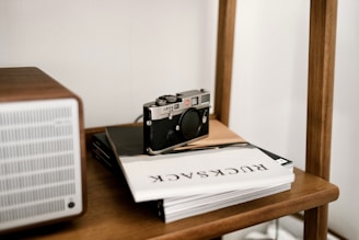 A sleek hidden security camera discreetly placed on a bookshelf.