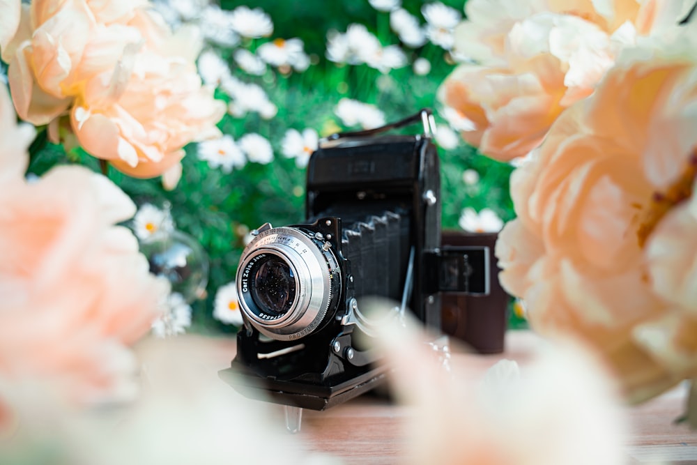 black camera on brown wooden table