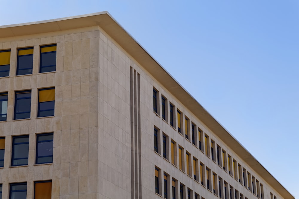 brown concrete building under blue sky during daytime