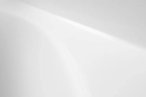 a black and white photo of a white wall