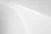a black and white photo of a white wall