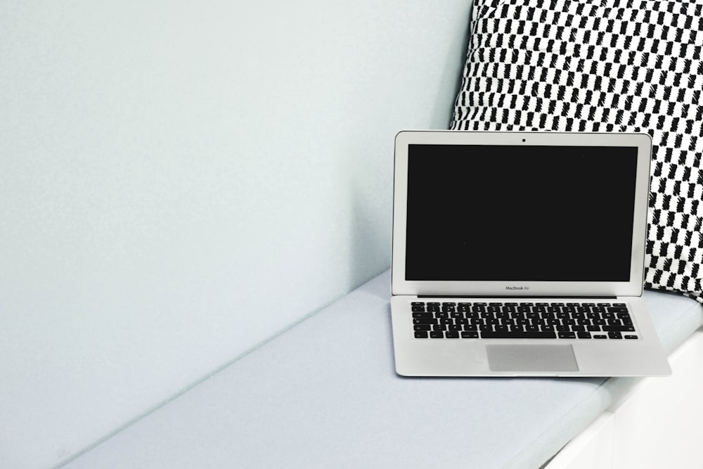 macbook air on white table