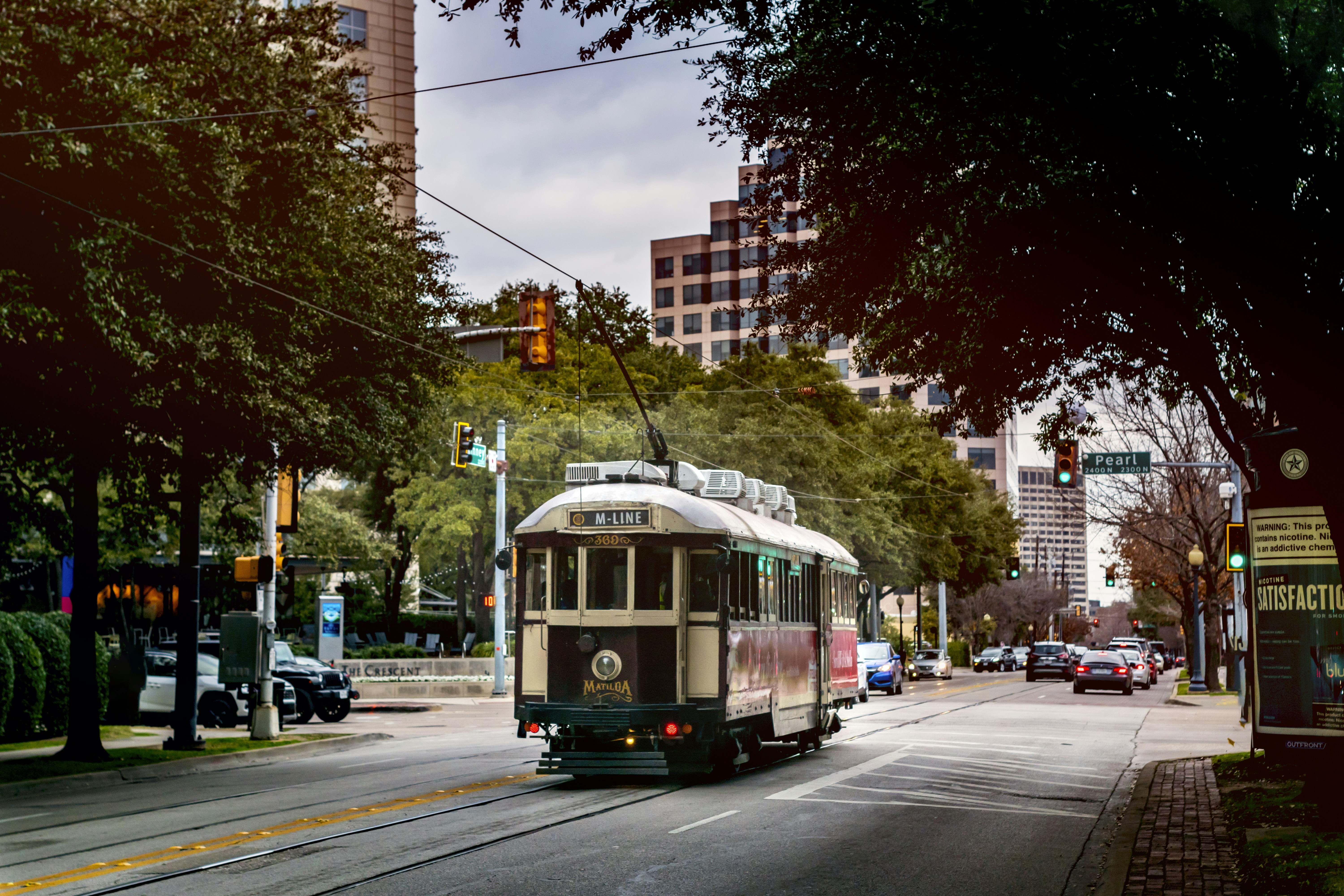 white and brown tram on road during daytime
