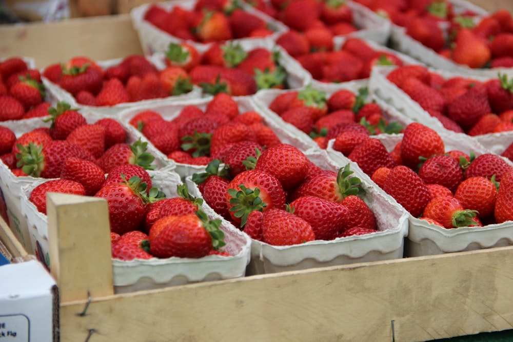 strawberries in brown wooden crate