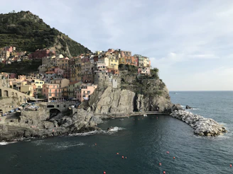 Charming whitewashed seaside village nestled on cliffs overlooking the turquoise sea.