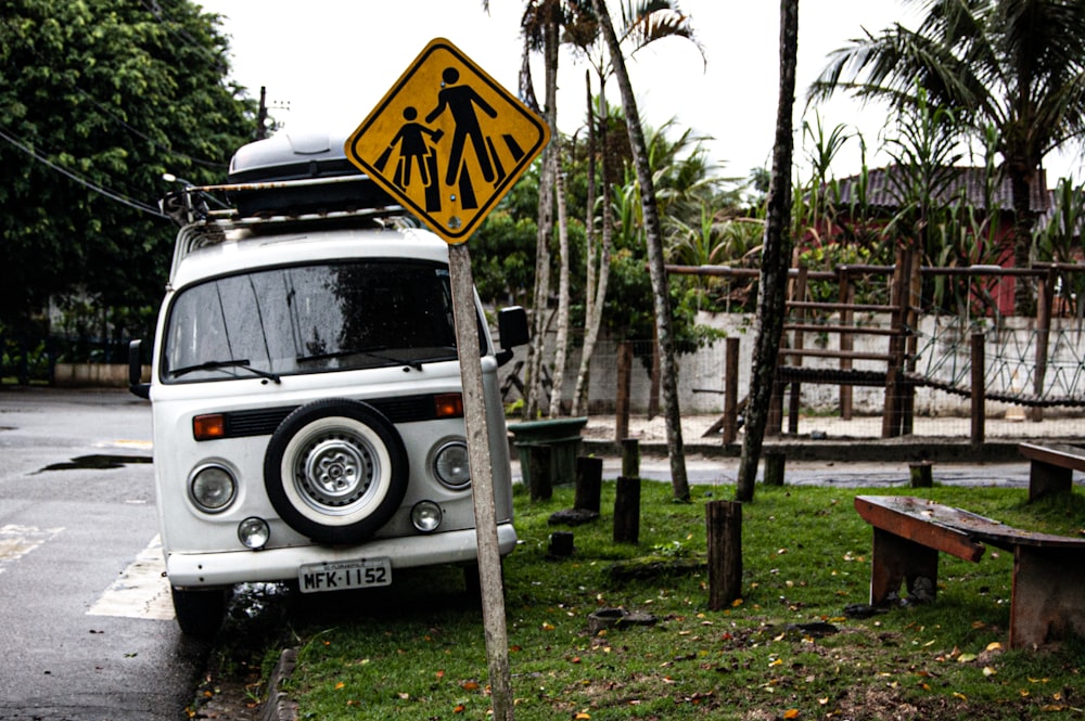 white and black jeep wrangler parked near trees during daytime