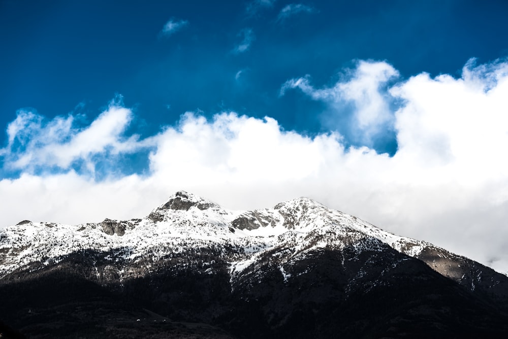 snow covered mountain under blue sky during daytime