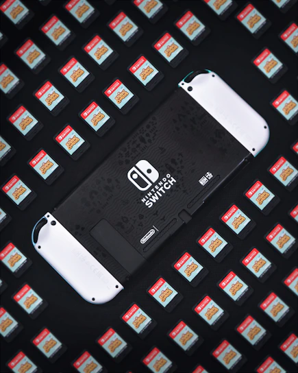 A vibrant collage of Nintendo Switch game covers and consoles arranged dynamically