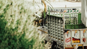 A vibrant photo of a modern vehicle wrapped in colorful advertising graphics.