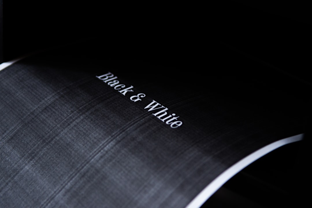 black and white plaid textile,
