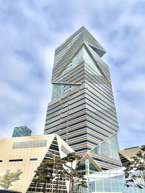 gray concrete building under cloudy sky during daytime