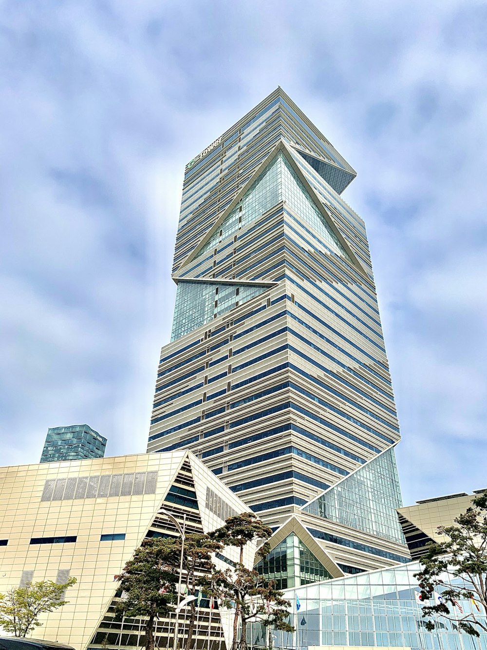 gray concrete building under cloudy sky during daytime