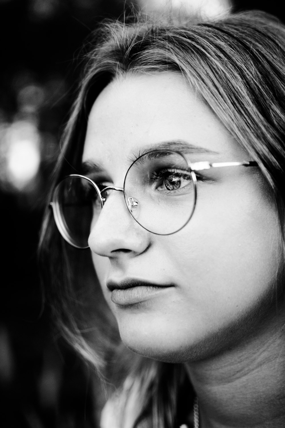 woman wearing silver framed eyeglasses