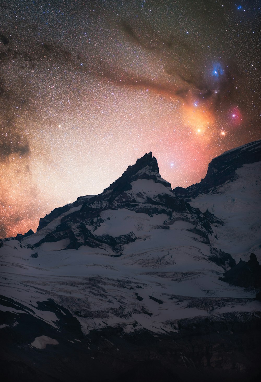 snow covered mountain under starry night