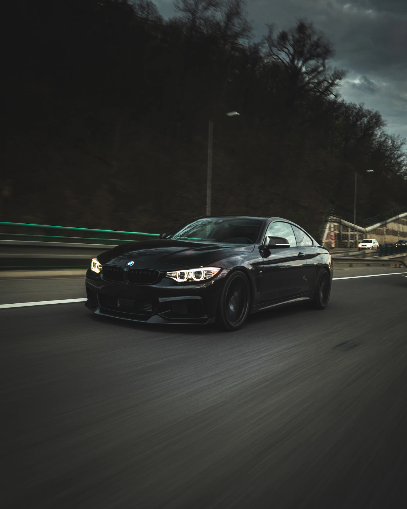 Black Mercedes-Benz coupe at night, representing the standard of our workshop