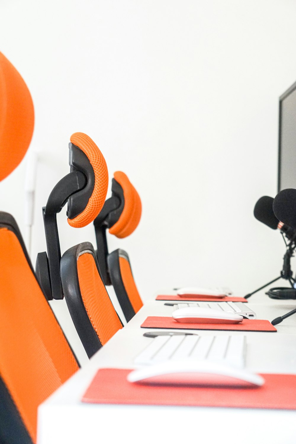 black and orange office rolling chair