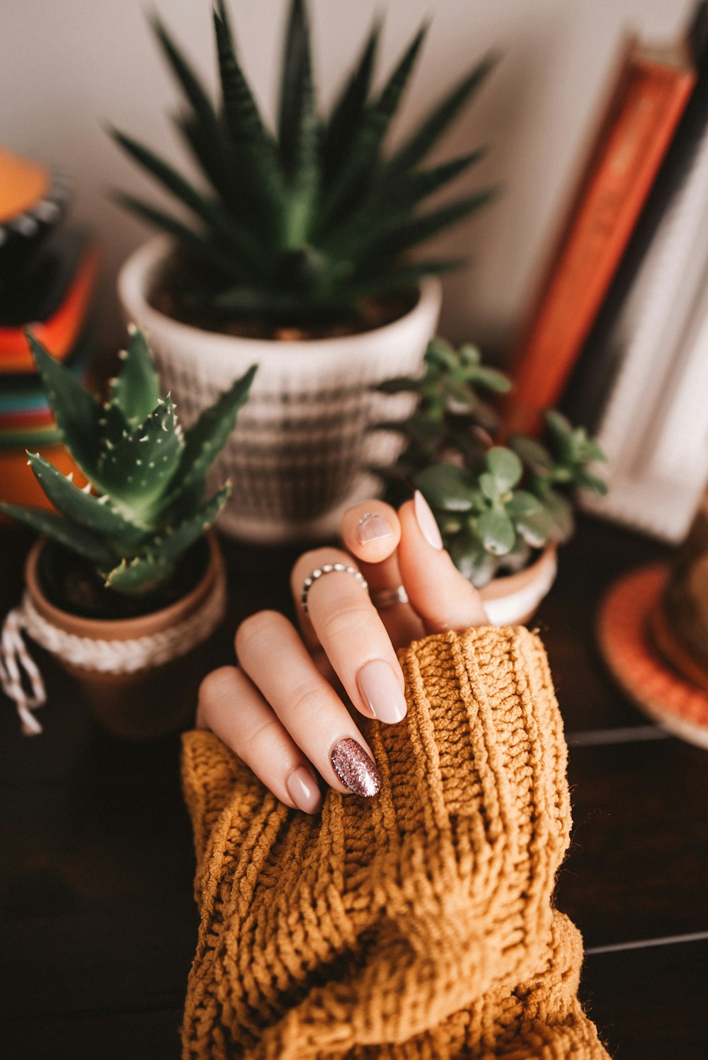 person holding brown woven basket