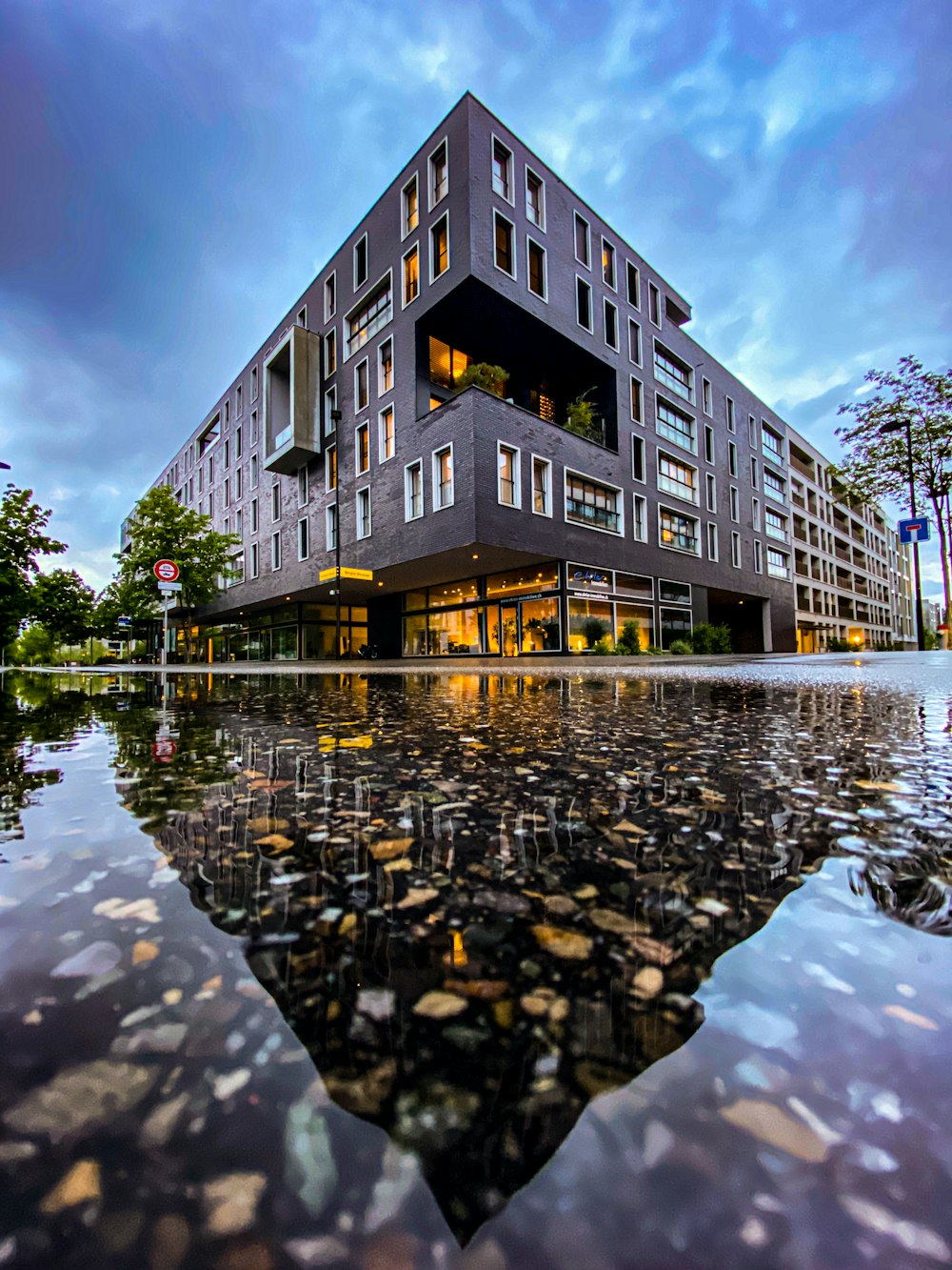 brown and white concrete building near body of water during daytime