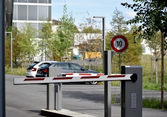 white and red sedan on road during daytime