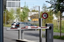 white and red sedan on road during daytime