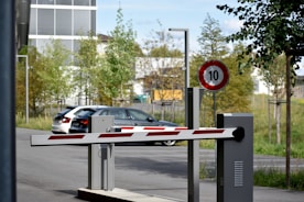 white and red sedan on road during daytime
