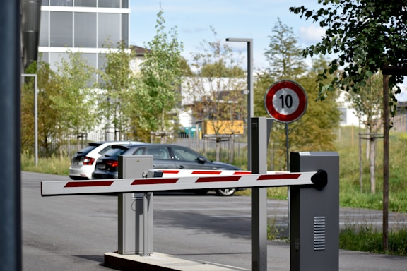 white and red sedan on road during daytime
