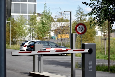 white and red sedan on road during daytime