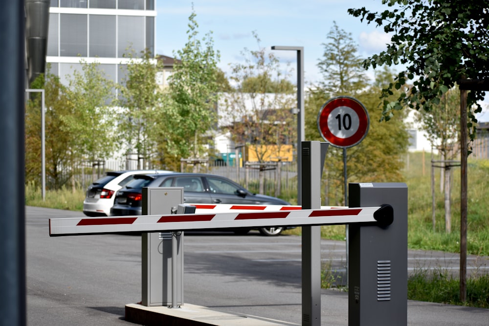 white and red sedan on road during daytime