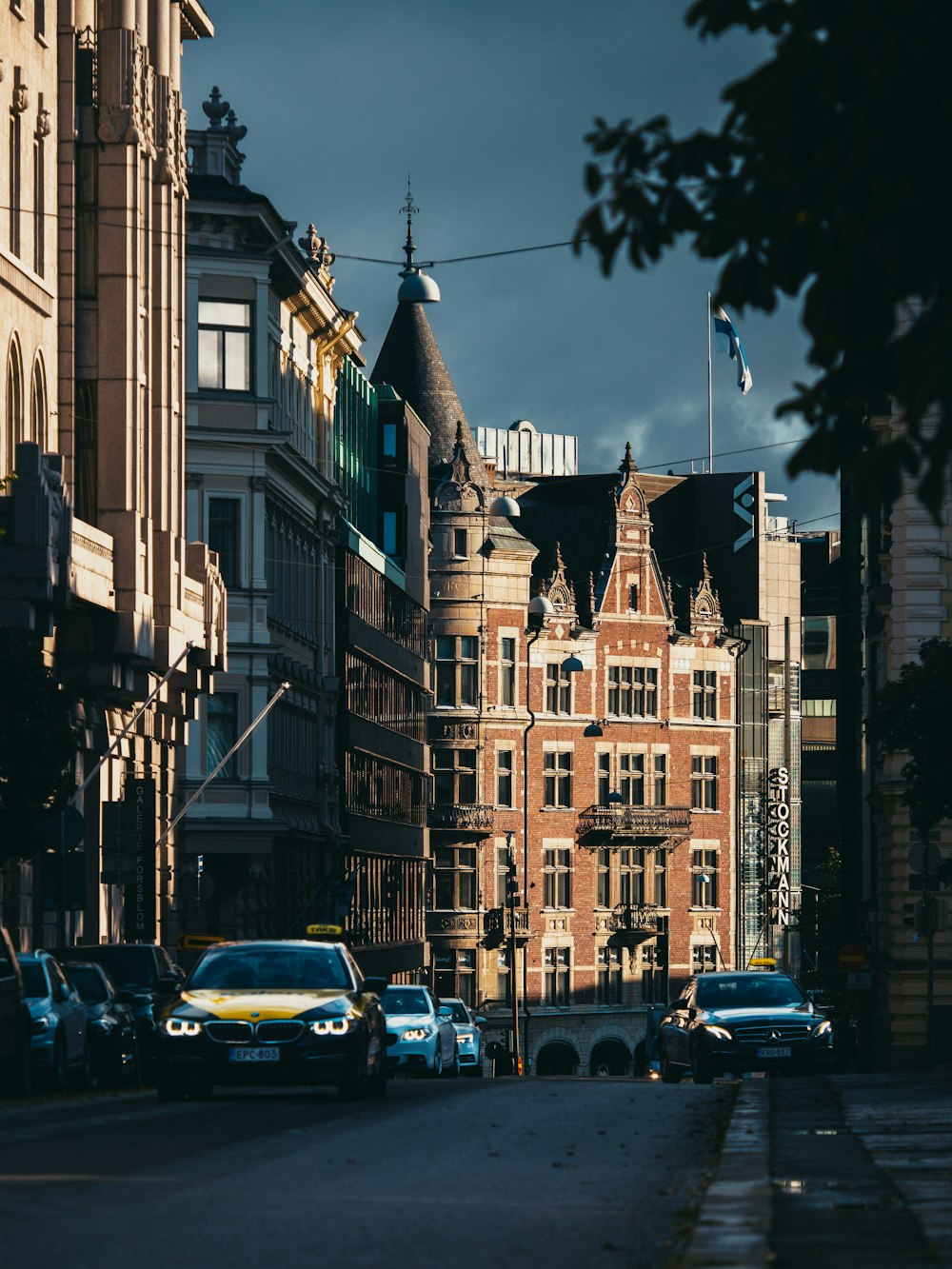 cars parked in front of building during night time