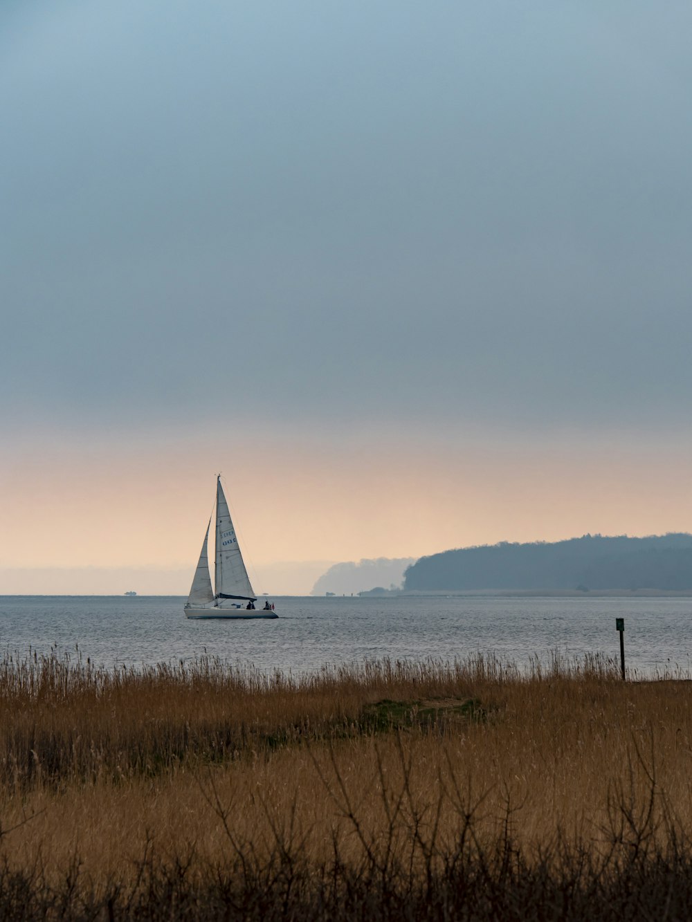 white sailboat on sea during daytime