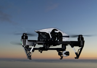 black and white drone on brown sand during daytime