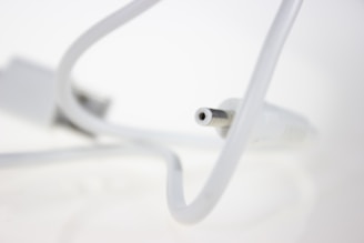Close-up of a durable USB camera cable connected to a professional camera.