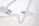 A close-up view of a white cable with a cylindrical connector in focus, set against a blurred white background. The cable curves gracefully, leading the eye to the connector tip.