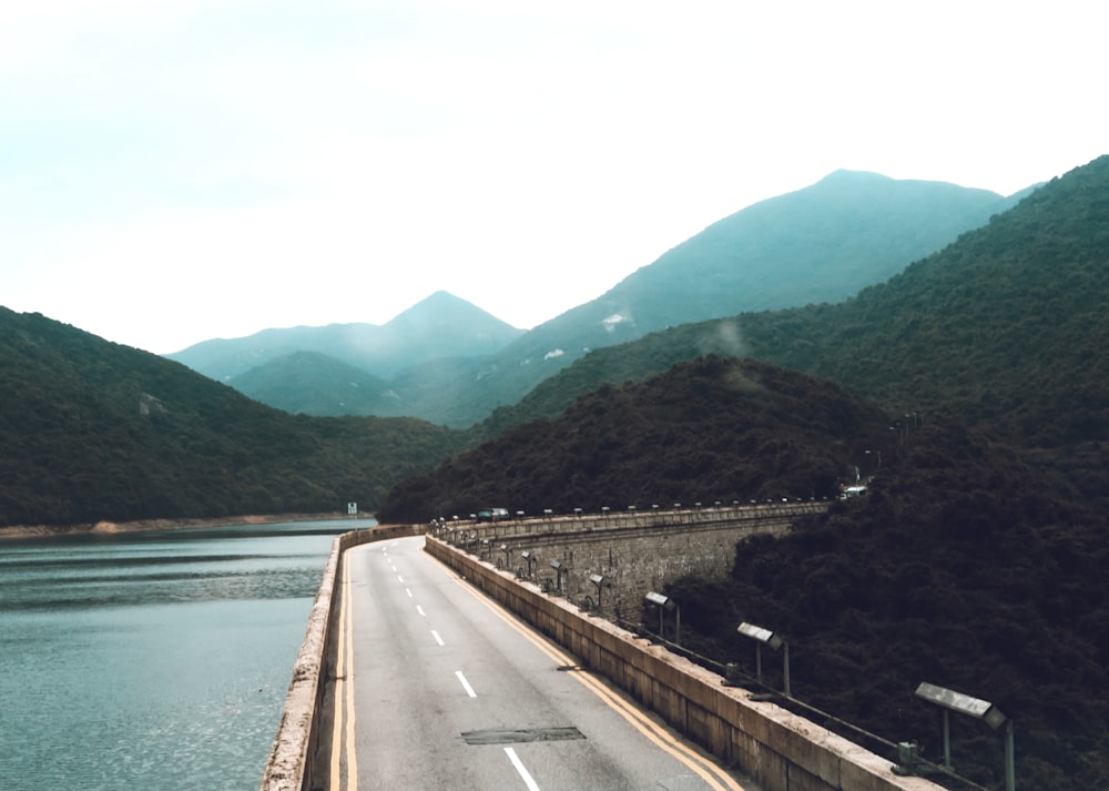 gray concrete bridge over river