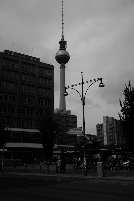 grayscale photo of street light in Fernsehturm Berlin Germany