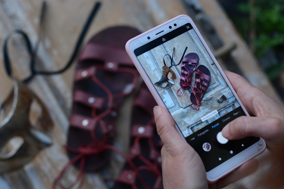 Person holding a smartphone displaying mobile advertising content