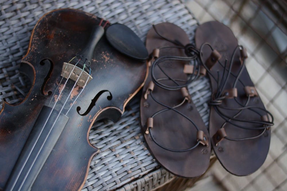 brown violin on white textile