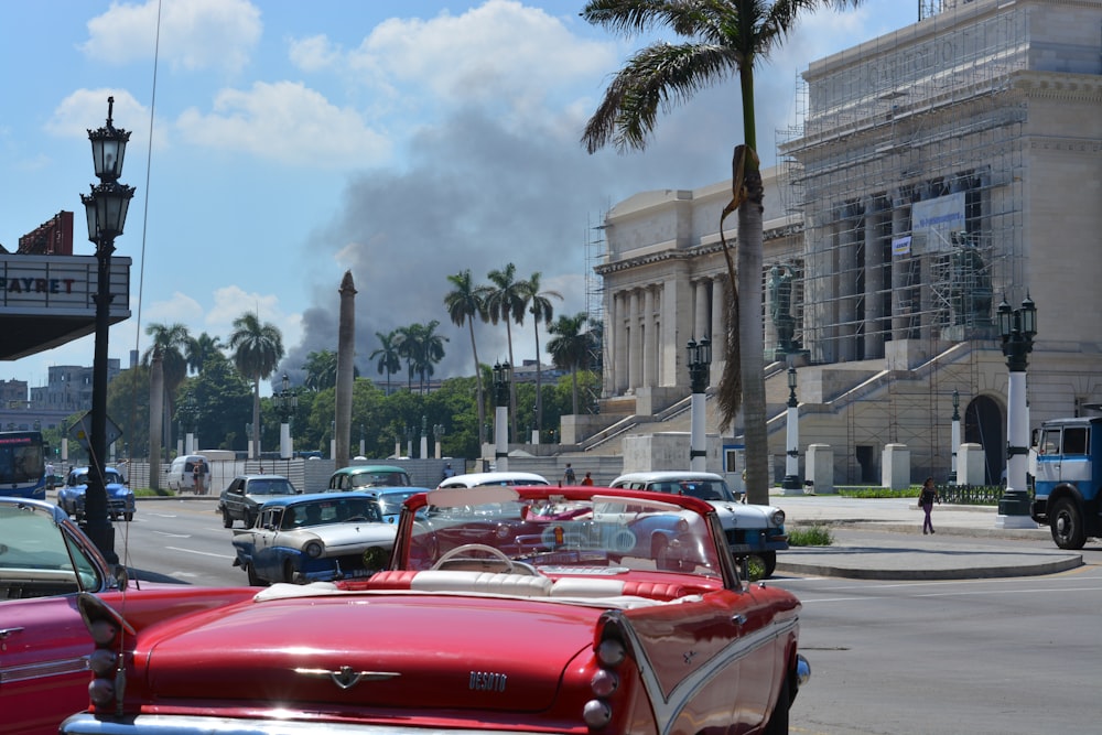 red convertible car on road near building during daytime