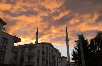 Elegant Algerian city skyline at dusk showcasing luxury residential buildings.