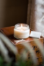 white candle on brown wooden table