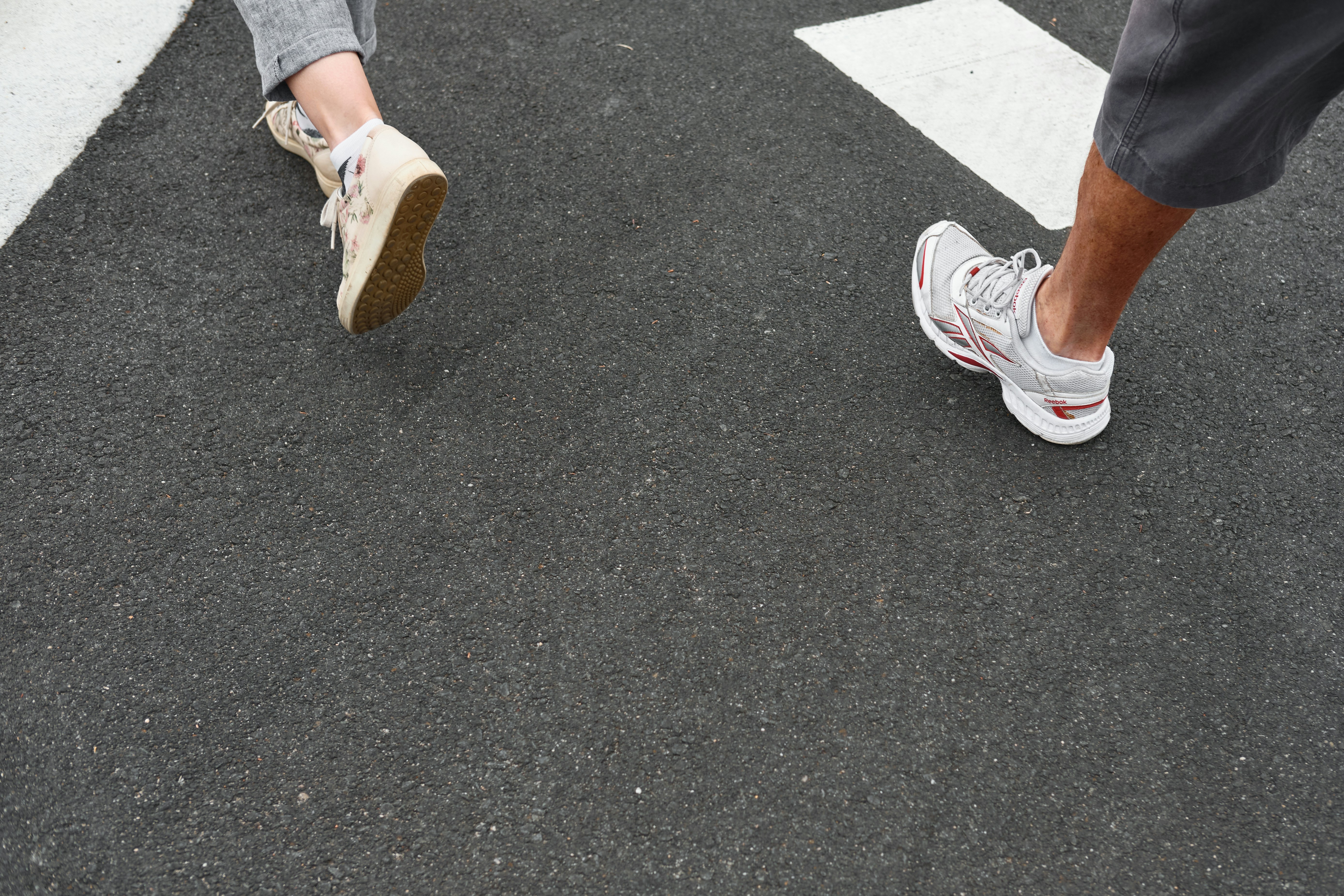 person in white and red sneakers