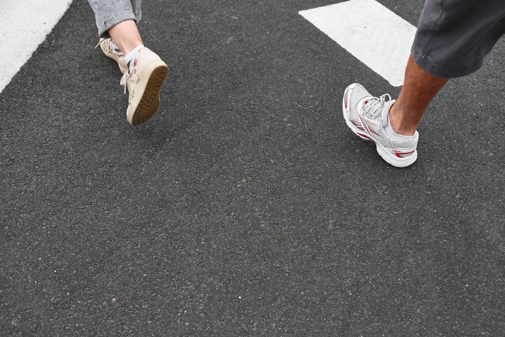 person in white and red sneakers