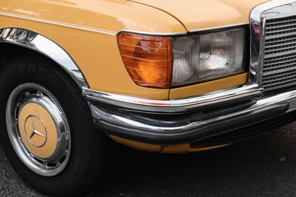 yellow car with black and silver car wheel