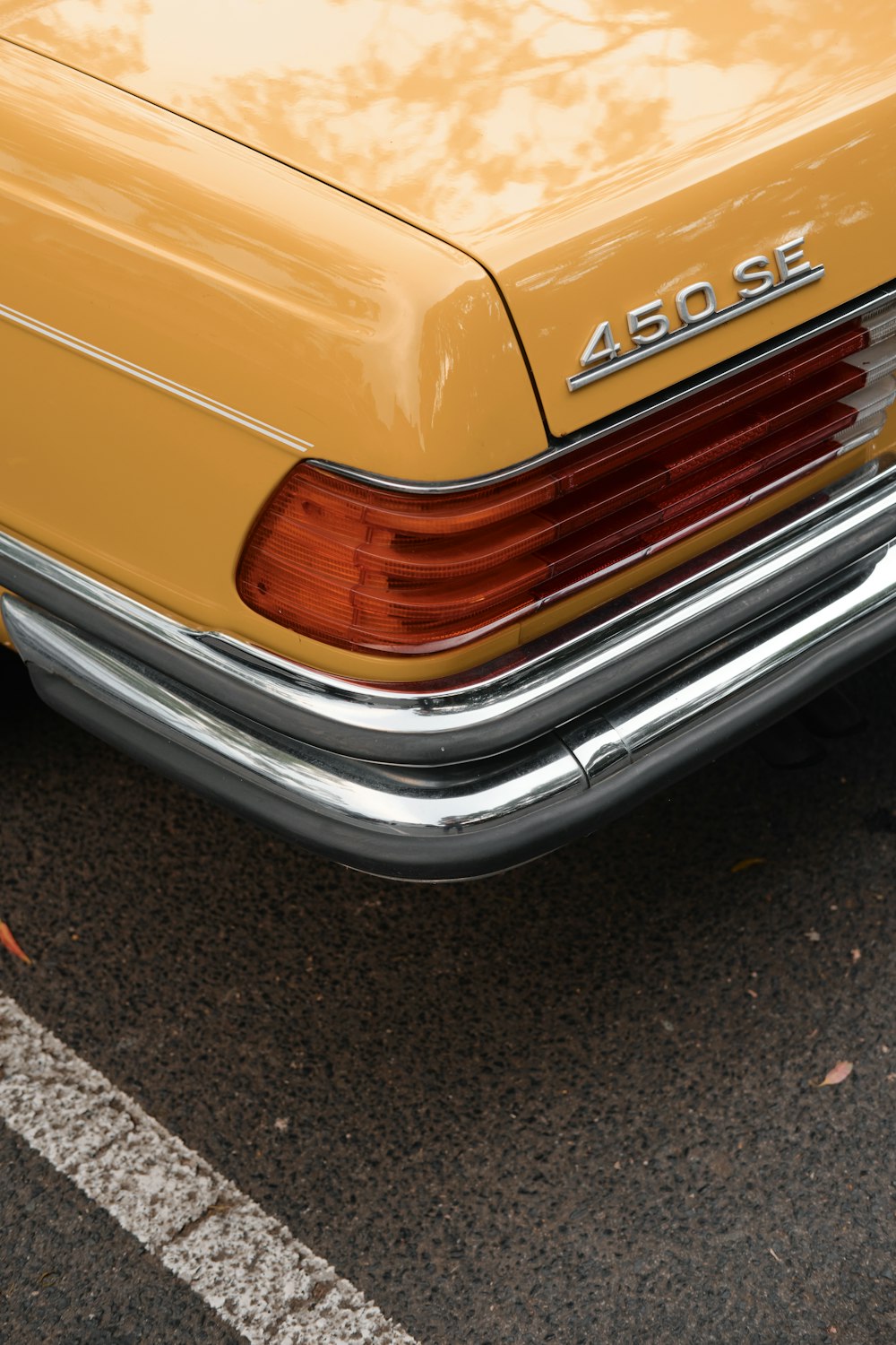 yellow and black car on road