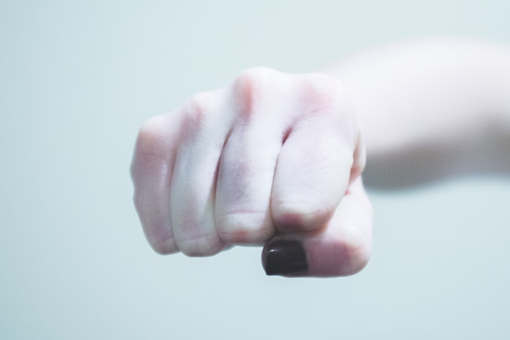 person holding black plastic tool