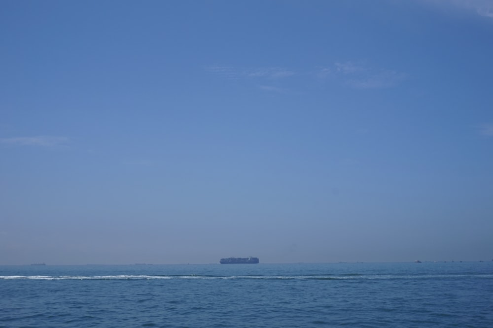 body of water under blue sky during daytime