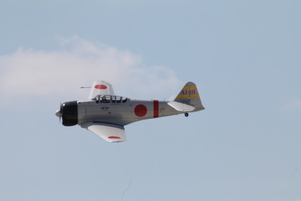 black and white jet plane in mid air during daytime